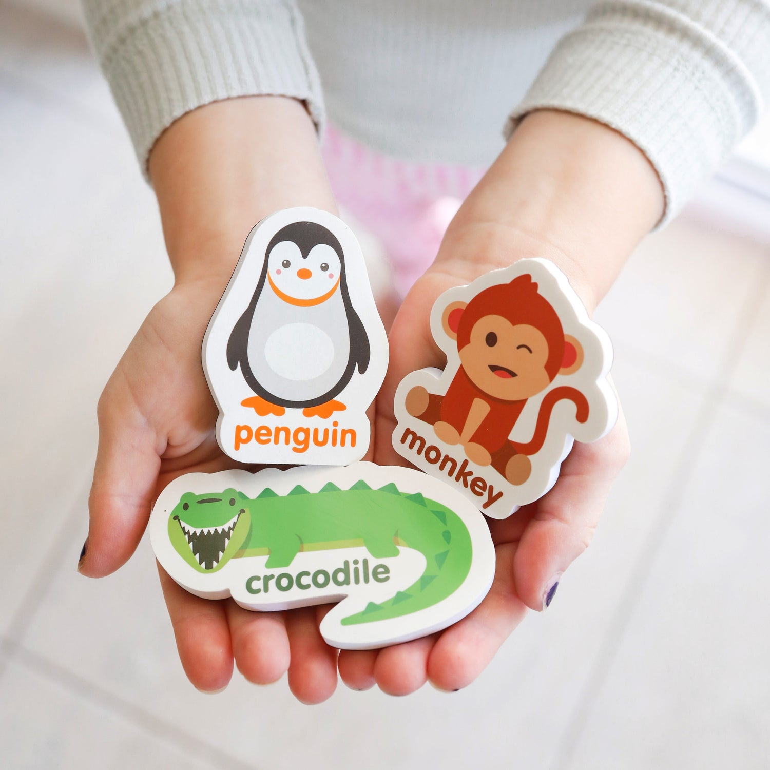 Toddler safe Animal magnets held by child